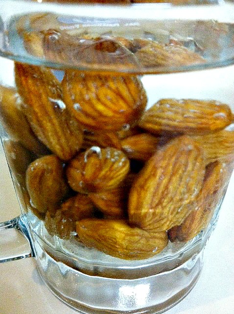 soak raw almonds in pure water about 6-8 hours. Jackets will release easily as well.